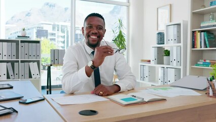 Canvas Print - Face of business black man planning, brainstorming and happy career with reading glasses at his office desk. Confident african worker, employee or professional person working on ideas and job goals