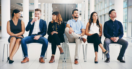 Canvas Print - New places, new faces. Shot of a group of diverse businesspeople waiting in line in a modern office.