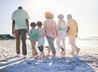 Wall Mural - Family walk on the beach, holding hands and generations with travel and summer vacation, solidarity and love outdoor. Grandparents, parents and children on holiday, people together with back view