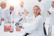 © ASDF - close up. senior female scientist sitting at a laboratory table.