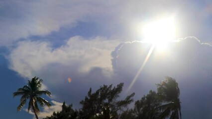 Wall Mural - The sun comes out from behind the clouds in Mexico.