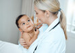 © Kay A/peopleimages.com - Caring for cute little people is so rewarding. Shot of a paediatrician examining a baby in a clinic.