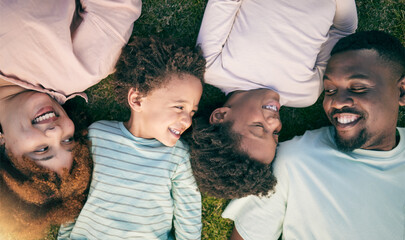 Poster - Smile, happy black family on grass from above mother, father and children lying together. Weekend, relax and people in garden, top view of woman, man and kids with happiness and love in South Africa.