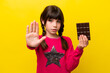 © luismolinero - Little caucasian girl with chocolat isolated on yellow background making stop gesture