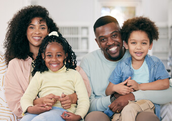 Happy, love and portrait of a black family in the living room sitting, relaxing and bonding together. Happiness, smile and young African man and woman resting with their children on a sofa at home.