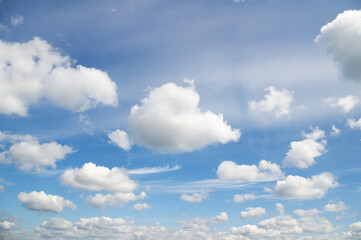 Wall Mural - Blue sky background with fluffy clouds