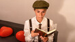 © Fabiano - portrait of a woman acting a man holding a book lost in his thoughts