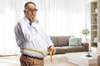 © Ljupco Smokovski - Sad mature man measuring waist at home