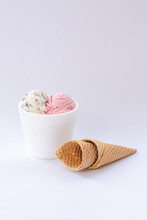 1/4 Strawberry Ice Cream And Granita With Cones On White Background.