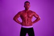 © SHOTPRIME STUDIO - Man athletic body bodybuilder in briefs with nude torso abs full-length in the background fitness classes, purple colored light. Advertising, sports, active lifestyle, competition, challenge concept.