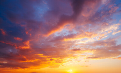 Wall Mural - utterly spectacular sunset with colorful clouds lit by the sun. bright epic sky.