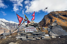 Low Angle View Of Prayer Flags On Mountain Against Cloudy Sky