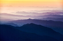Scenic View Of Silhouette Mountains Against Sky During Sunrise
