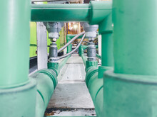 Close-up Of The Pipes And Valves Of A Factory Heating System