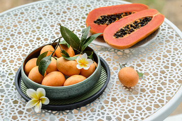 Wall Mural - mango plum and papaya on the table