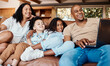 Laptop, happy family and kids with online video, movies or cartoon on couch on live streaming service, learning or bonding. Biracial mom, father and children watch film or show on computer and sofa