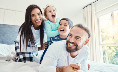 Wall Mural - Portrait, family and laughing on bed in home, having fun and bonding together. Comic, love and care of happy father, mother and kids or boys playing, smile and enjoying quality time in house bedroom.