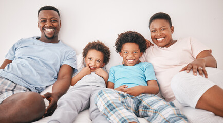 Wall Mural - Black family, smile and portrait of parents with children on bed for bonding, quality time and relax together. Love, happy and African mom, dad and kids in bedroom enjoy morning, weekend and holiday