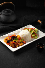 Wall Mural - Portion of chinese braised chicken with rice and salad lunch
