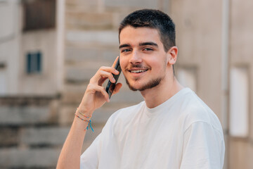 Poster - young teenager on the street talking on the mobile phone