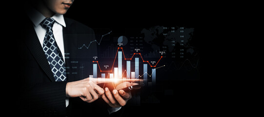 Businessman analyst working with digital finance business data graph showing technology of investment strategy for perceptive financial business decision. Digital economic analysis technology concept.