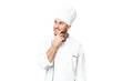 © luismolinero - Young blonde man Chef over isolated chroma key background thinking an idea while looking up