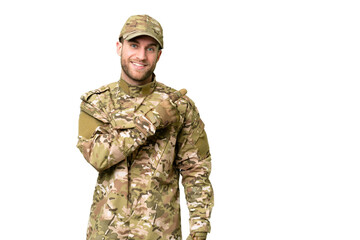 Wall Mural - Military man over isolated chroma key background pointing to the side to present a product