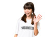 © luismolinero - Little volunteer girl over isolated background saluting with hand with happy expression