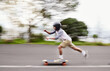 © M Einero/peopleimages.com - Skateboard, motion blur and man speed on road for sports competition, training and exercise in city. Skating, skateboarding and male skater ride for adrenaline, adventure and freedom for challenge
