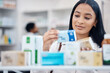 © M Einero/peopleimages.com - Pharmacy, woman and customer shopping for medicine box, supplements product search or drugs store pharmaceutical. Retail hospital shop, clinic pills shelf or client face for medical healthcare choice
