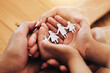 © Allistair F/peopleimages.com - Hands, family and paper cutout, support and connection, link and bonding, foster care and adoption. Palm, parents and child with parenthood, art and craft with solidarity and community with trust