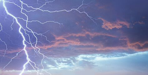 Wall Mural - lightning strikes between stormy clouds.
