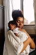 © Djavan Rodriguez - Mother holding a newborn.