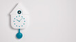 Modern cuckoo clock on the white wall with copy space for text.3D rendering



 