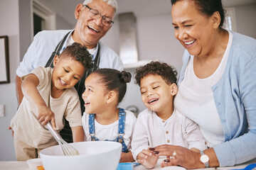 Poster - Are those little balls or lumps. Shot of a mature couple baking with their grandkids at home.