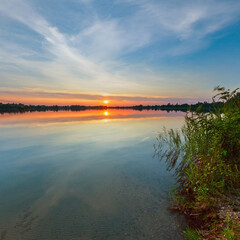 Wall Mural - picturesque summer evening sunset lake calm shore. concept of tranquil country life, eco friendly to