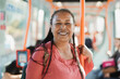 © Sabrina - African senior woman smiling on camera inside tram