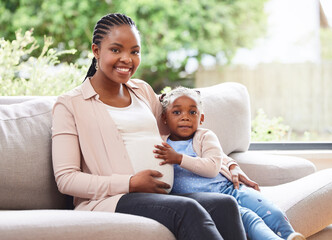 Sticker - I thought it was time for another one. Cropped portrait of an attractive young pregnant woman and her daughter sitting on the sofa at home.