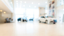 Blurred Abstract Dealership Store, With Defocused Cars, Clients And Staff With  Soft Lightning