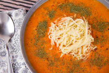 Sticker - Tomato soup with noodles on a wooden background