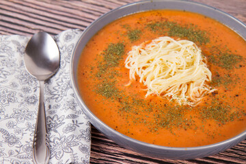 Sticker - Tomato soup with noodles on a wooden background