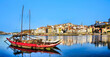 Oporto medieval city cityscape - Rabelo boat in Douro river - Porto, Portugal