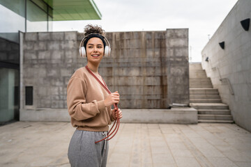 Wall Mural - one woman young adult caucasian female with jumping rope training