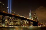 Fototapeta  - Brooklyn bridge with Tribute in Light . The installation of 88 searchlights has been displayed annually in remembrance of the September 11, 2001 attacks.