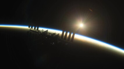 Wall Mural - international space station iss floating in orbit above planet earth in outer space. sunrise or suns