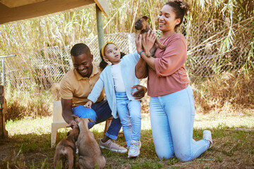 Wall Mural - Family, dog adoption and pet outdoor with a happy mother, girl and dad with a puppy. Happiness, love and animal shelter care of a mom, child and man hug and hold dogs together with a smile in a park