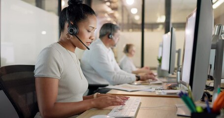 Wall Mural - Customer service, call center and black woman typing on computer at night. Contact us, crm telemarketing and group of employees, sales agents or consultants on pc working late in company workplace.