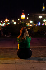 Blonde girl sitting on the sidewalk, Bordeaux