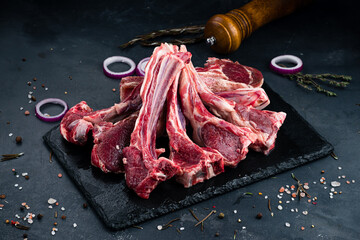 Canvas Print - Raw beef ribs for grilling with spices and salt.