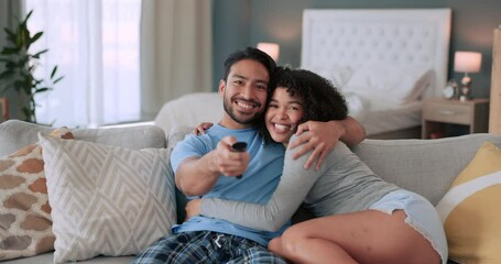 Poster - Love, couple and television with a man and woman on the sofa to relax while watching tv in their home. Happy, smile and excited with a young male and female sitting in the living room together